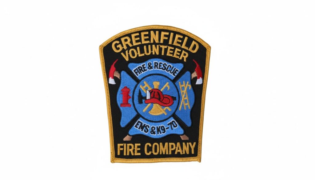 a patch with the fire department symbols and Greenfield Volunteer Fire Company written on it.